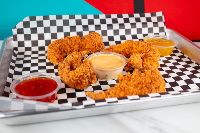 Four buttermilk chicken tenders with dips
